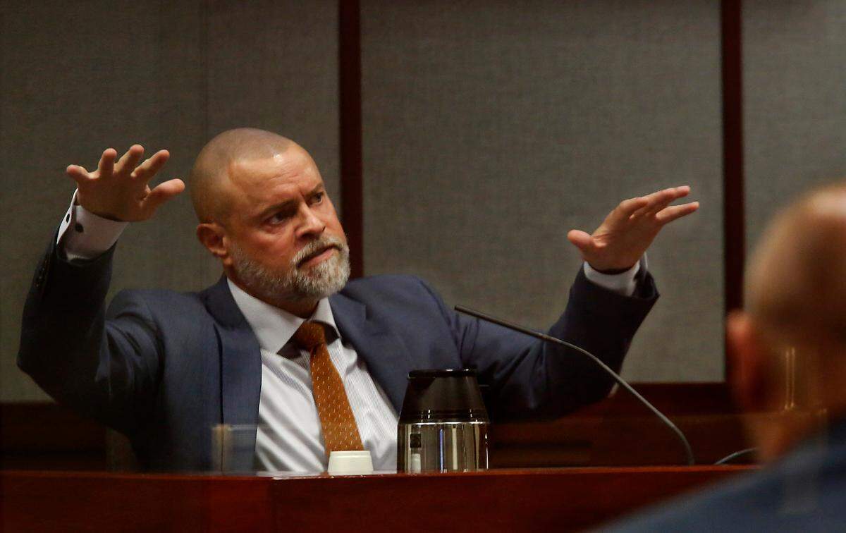 Judge Sam Swanberg gestures with his hands to help describe the layout of his house while answering questions by his defense attorney Scott Johnson while giving testimony in a Franklin County courtroom during his domestic violence trial.