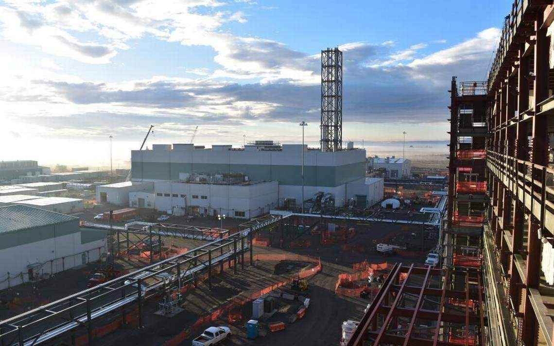 The Hanford site vitrification plant is shown during construction at sunrise.