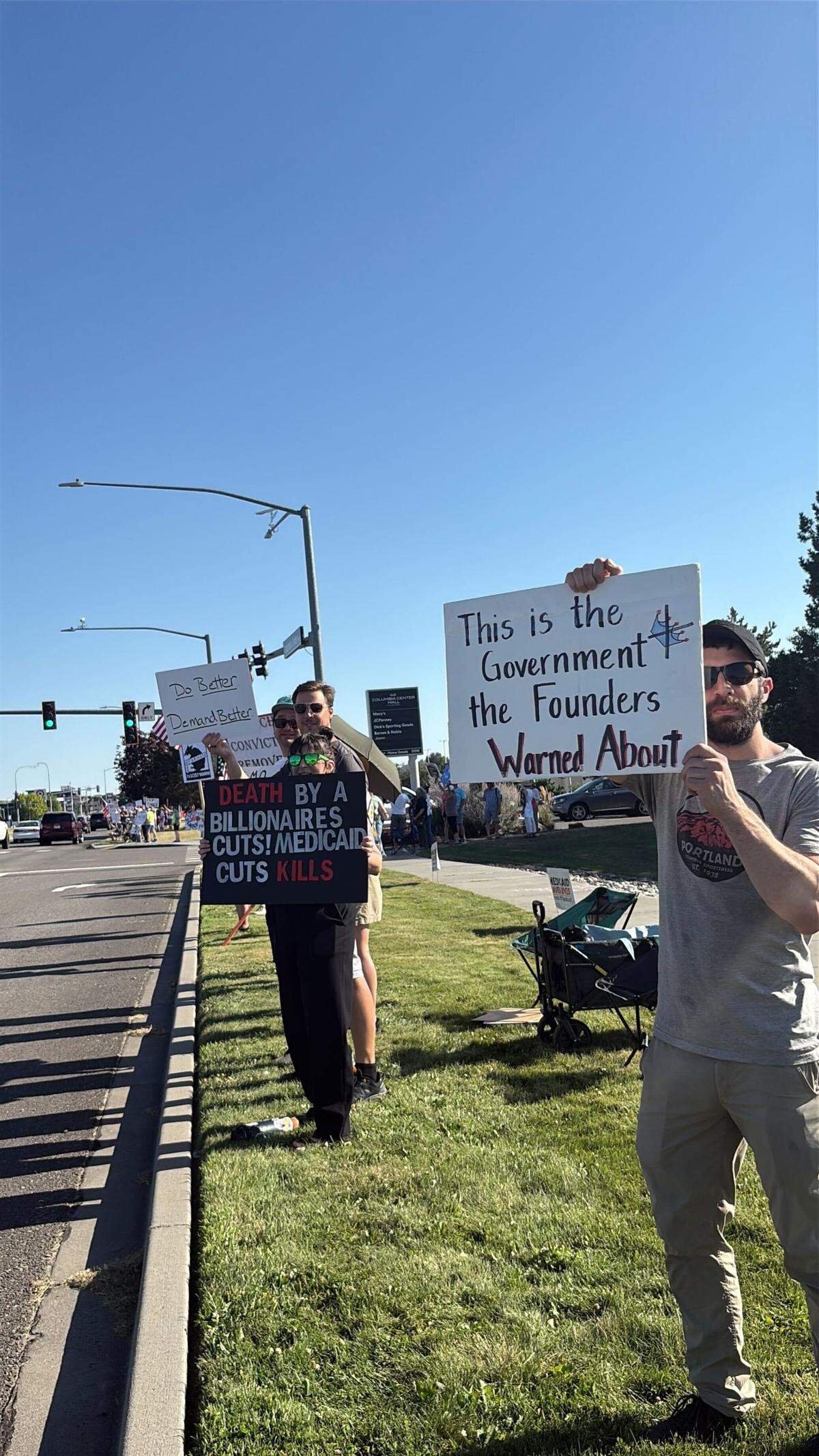 Among the many topics on signs at the “Good Trouble Lives On” demonstration in Kennewick, Wash. on July 17 were numerous mentions of Medicaid cuts, veterans resources and threats to democracy.