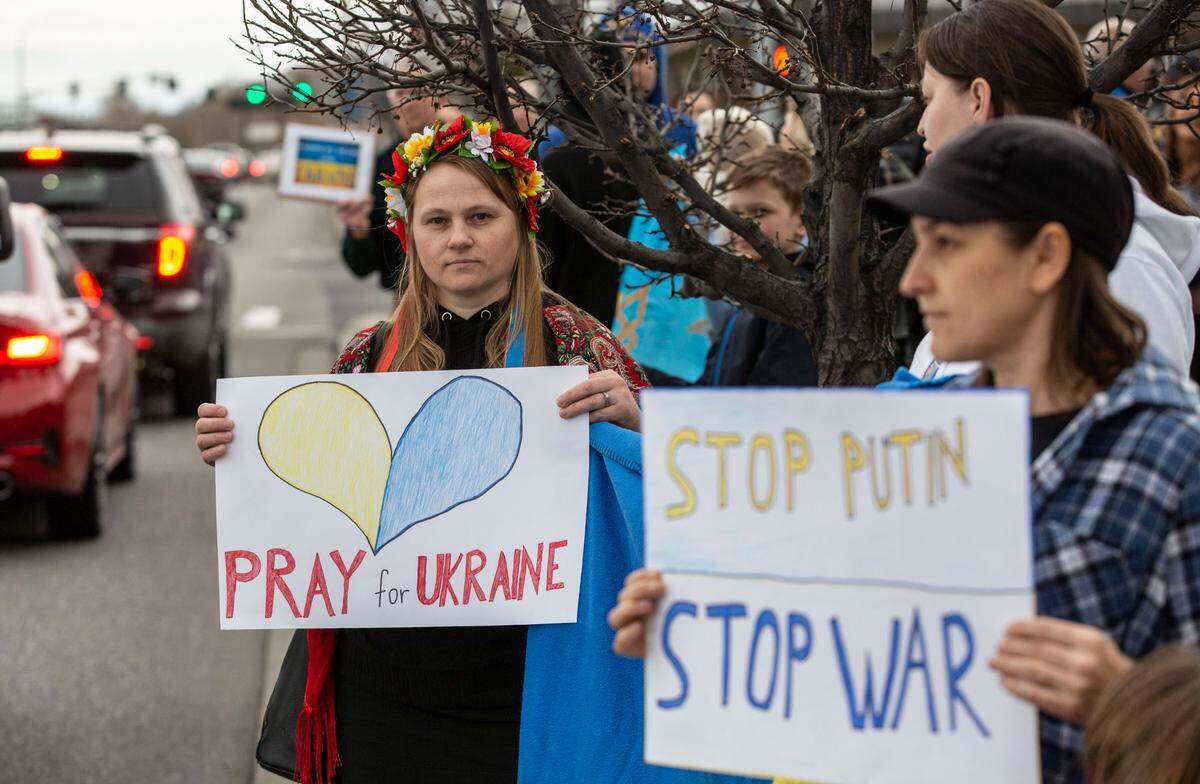 Irina Koval of Pasco stands clad in a hustka, a traditional Ukranian shawl, and flower headpiece as she and about 300 Tri-Citians gathered in March 2022 to show support for Ukraine and denounce the Russian-instigated war.