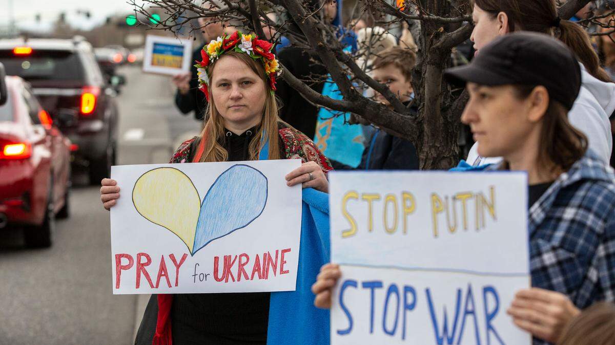 Irina Koval, of Pasco, stands clad in a hustka, a traditional Ukranian shawl, and flower headpiece as she and about 300 Tri-Citians gathered in 2022 at John Dam Plaza to show support for Ukraine and denounce the Russian-instigated war.