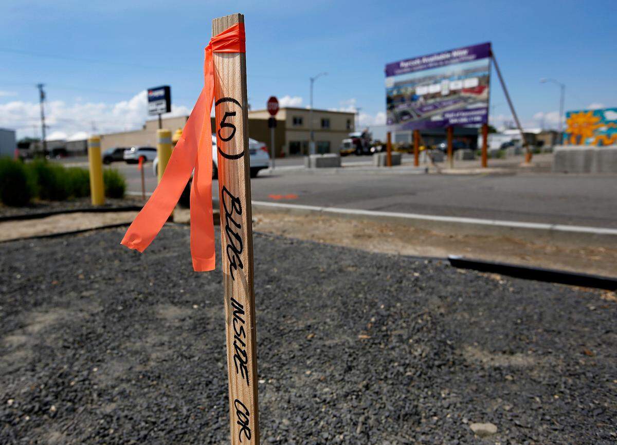 A wooden survey stick at the Kennewick site shows where a corner of the restaurant building will be.