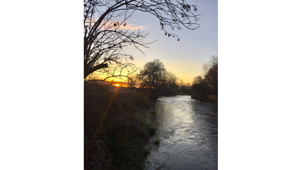 The sun sets early over Blue Mountain streams during the winter months.
