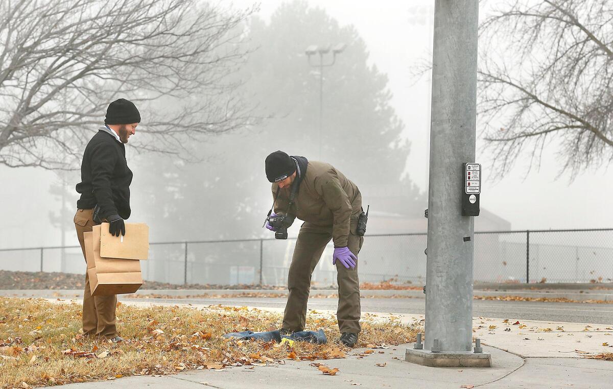 Richland detectives photograph a pair of jeans at the corner of Swift Boulevard and Long Avenue during their investigation into a reported abduction the previous night. The owner of the items was found and the incidents are unrelated, police said. Watch a video at: tricityherald.com/video