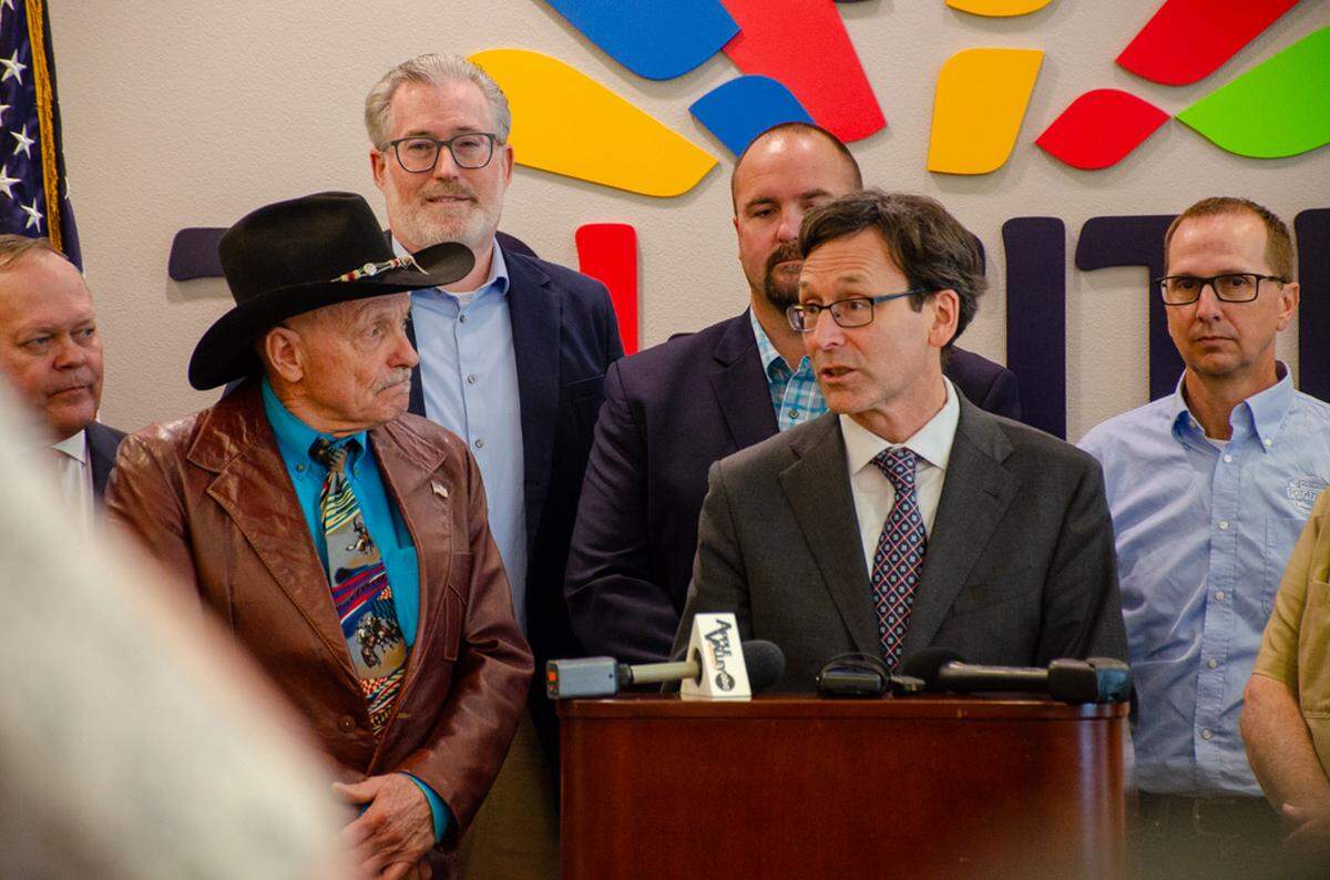 Gov. Bob Ferguson signs into law a bill that provides exemptions for fuels used for agriculture from the Climate Commitment Act during an event Thursday in Kennewick. The bill was sponsored by Rep. Tom Dent, R-Moses Lake.