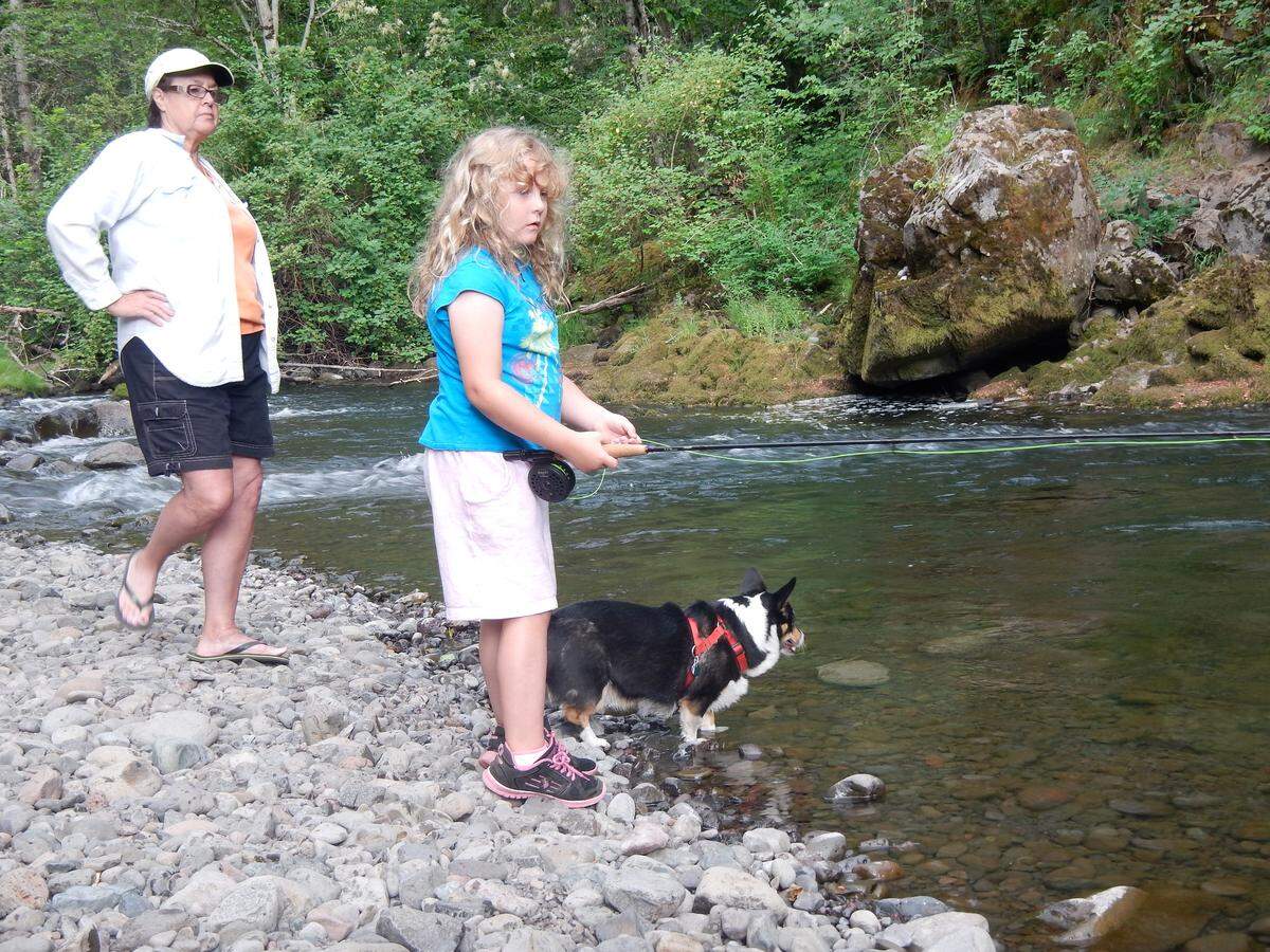 Learning how to fly fish is easy when your grandmother and her faithful dog point out where to cast. (Nancy Dauble, Lucy the corgi, and granddaughter, Sofia Romig)