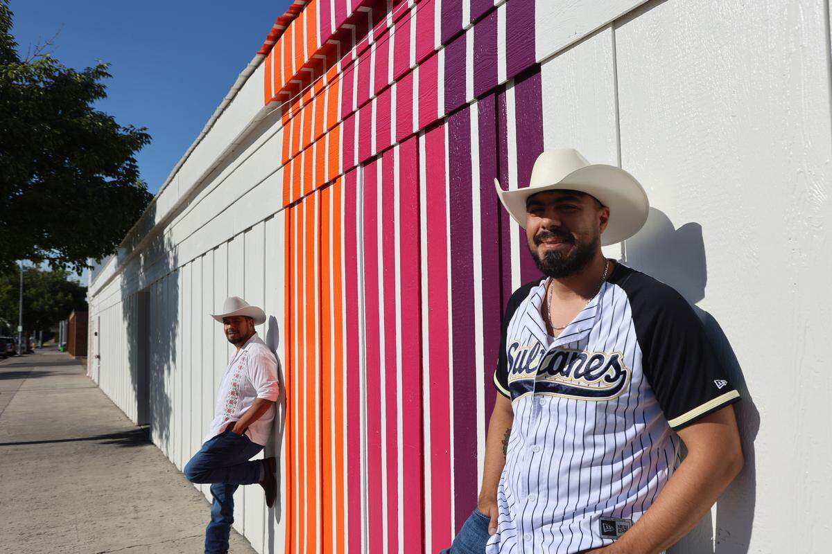 Managers Pedro and Fernando stand outside Azúcar at Out and About.