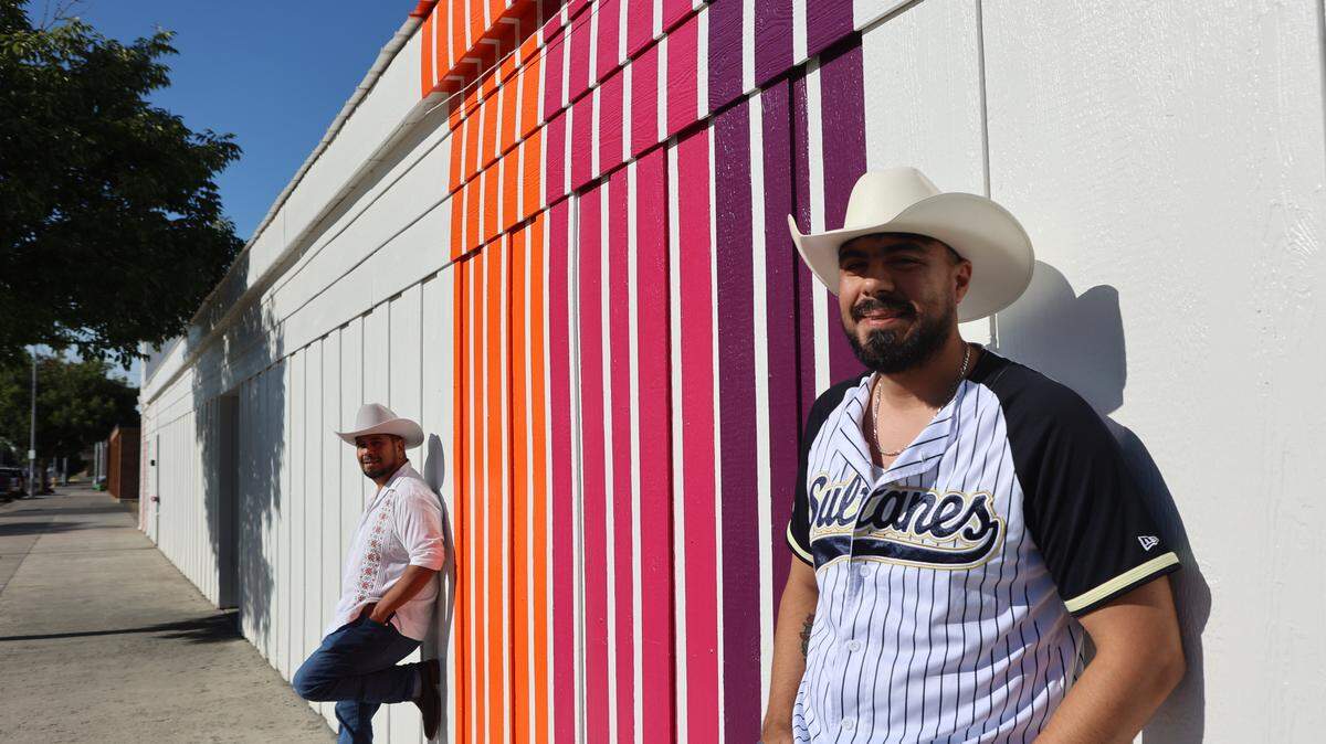 Managers Pedro and Fernando stand outside Azúcar at Out and About.