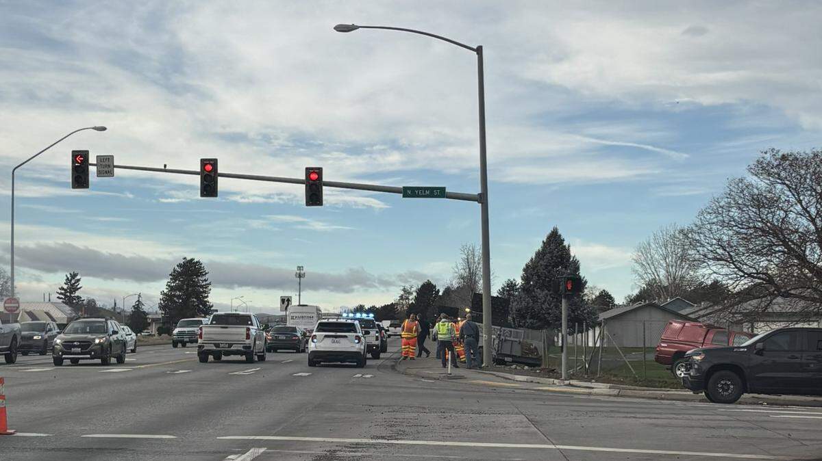 A pickup crashed through a Highway 395 work site and left four state road workers hurt.