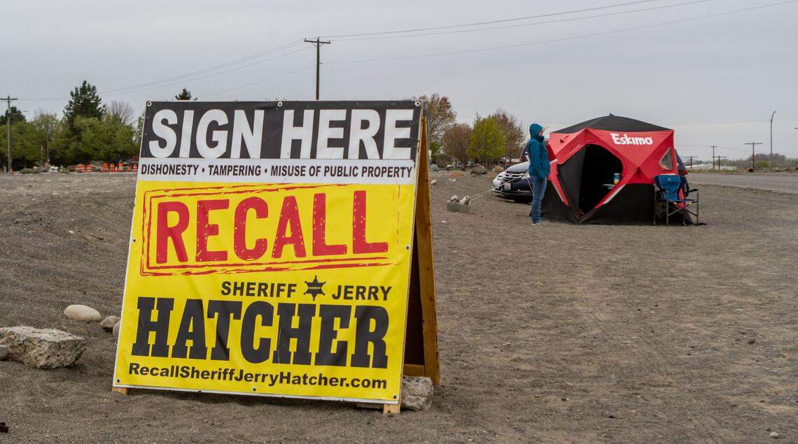 Members from the Committee to Recall Sheriff Jerry Hatcher waited outside the Benton County Fairgrounds to gather signatures for their petition to recall the embattled official.