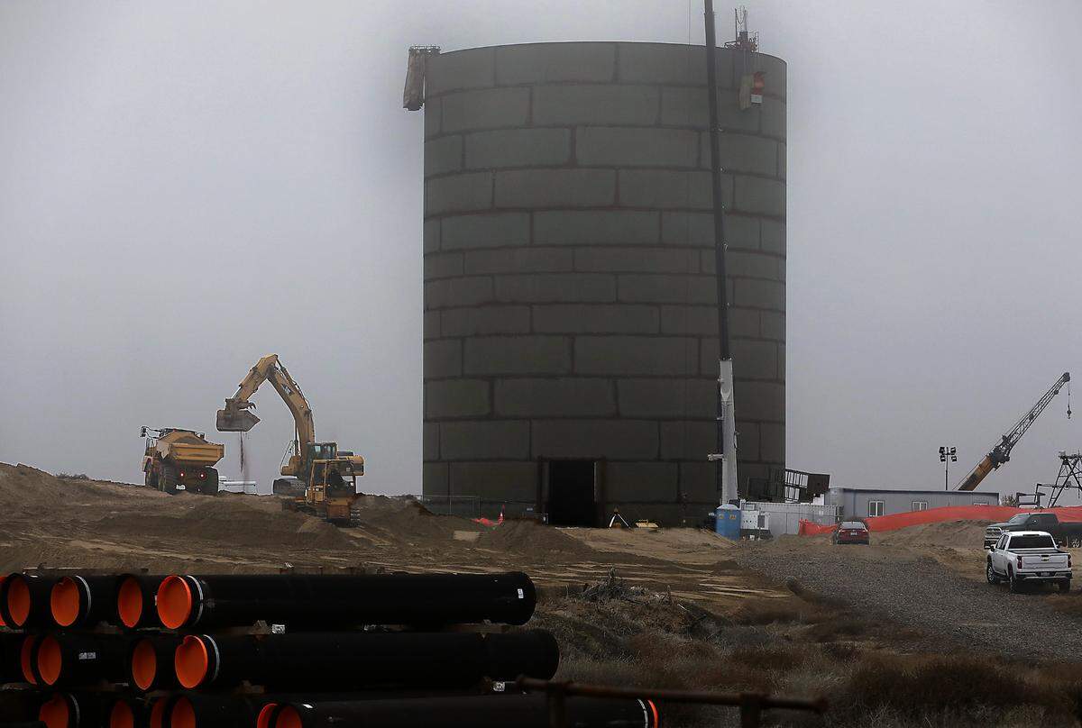 Construction crews work on building a new 3.5 million gallon 165-foot tall elevated skirted tank water reservoir off Burns Road near Road 90 in west Pasco. The new water storage project being built to help meet increasing demand of new business and housing developments. The cost of the project is about $17 million, said project manager Brian Cartwright.