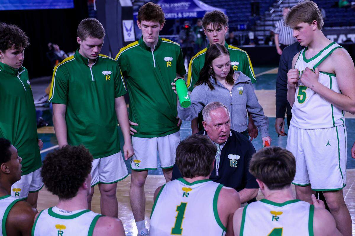 Richland basketball head coach Earl Streufert talks with the team during their game quarterfinal victory over West Valley in March 2026.