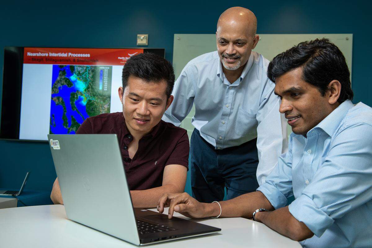 From left, PNNL researchers Wenwei Xu, Tarang Khangaonkar and Lakshitha use a new predictive ocean-modeling tool to study how the Salish Sea will respond to climate change, looking ahead as far as 2095.