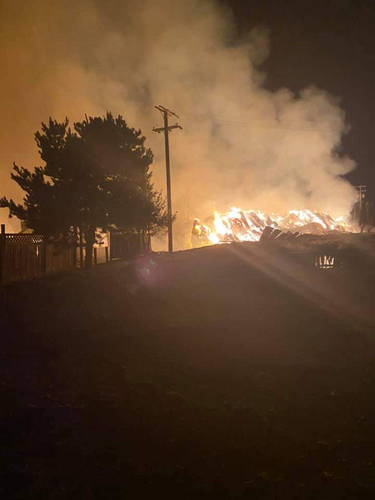 A hay processing facility burned early Tuesday northeast of Basin City. Firefighters were able to contain the fire to the building.