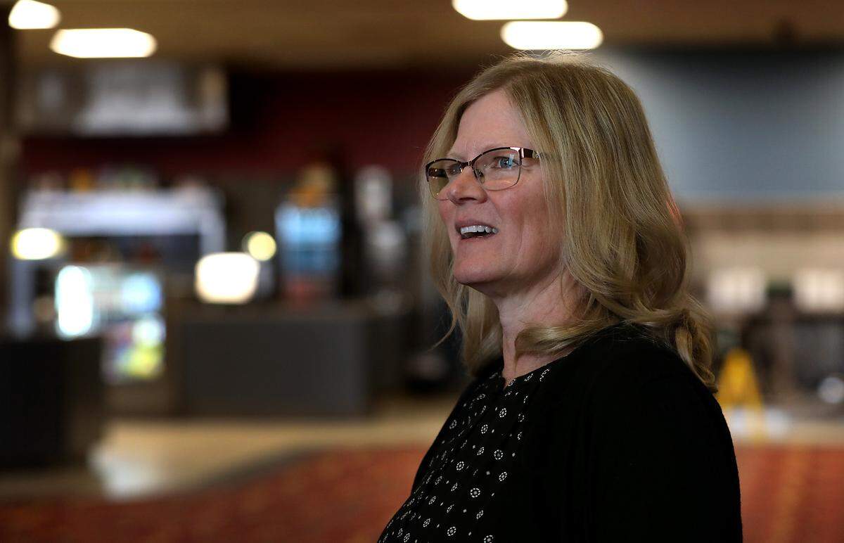 General manager Mamie Gale talks about a remodeling project scheduled for 2025 of the Pasco Farichild Cinemas while standing in the theatre’s lobby.