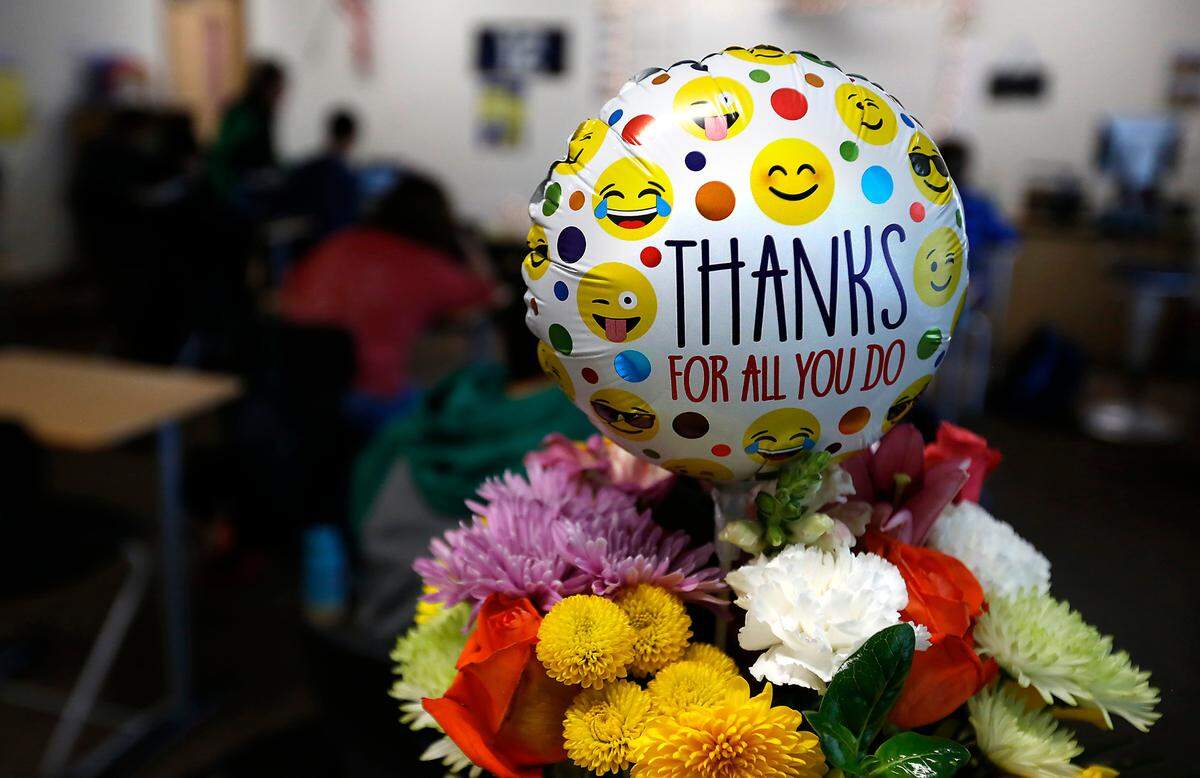 Flowers and a balllon sit of the desk of special education paraeducator Nan Duncan at Richland High School after Richland School District leaders nominated her for state Classified School Employee of the Year. She has sent the past 34 years supporting Richland students receiving special education services.