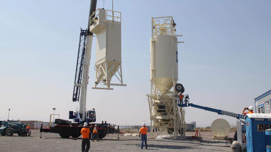 Workers have set up a mobile batch plant to prepare engineered grout to fill the second PUREX plant tunnel storing radioactive waste at the Hanford nuclear reservation. The tunnel is at risk of collapse.