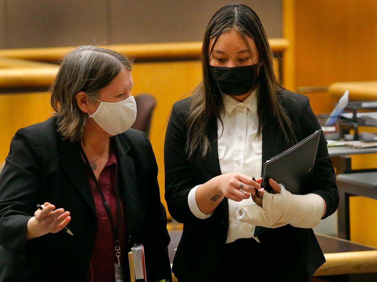 Jennifer Ana Duong, right, the 19-year driver charged with death of her three passengers in the early Sunday high-speed crash in Richland, walks out of a Benton County Superior courtroom with her defense attorney, Shelley Ajax, following a March hearing.