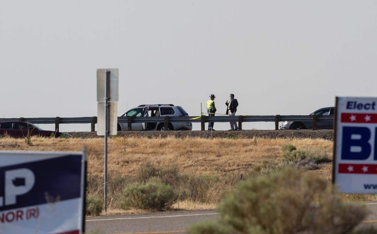 Police investigate an officer-involved shooting that occurred during a traffic stop on the Interstate 182 ramp from Road 68 in Pasco around 3 p.m. Thursday, July 30.
