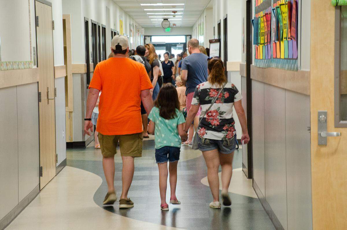Families walk through the hallways on August 2022 in the new Desert Sky Elementary school in West Richland.