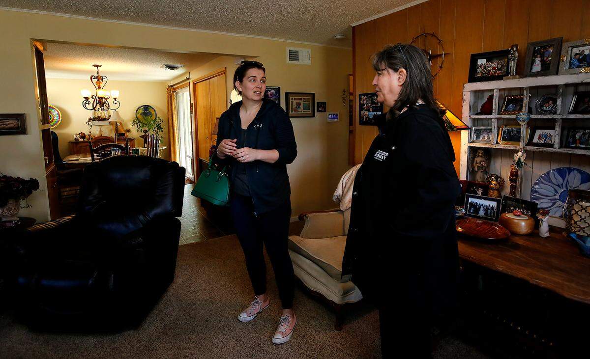 Broker Shannon Jones, right, with Berkshire Hathaway HomeServices, talks with Richland resident Megan Simpson during a recent open house. Open houses are growing in popularity since the pandemic.
