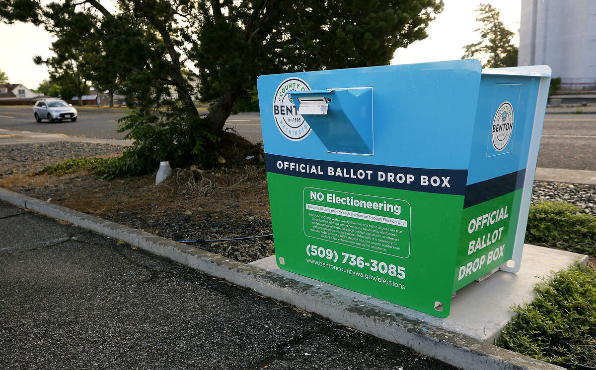 Benton County ballot drop boxes now have a different look with redesigned graphic covering them. The drop box is in downtown Kennewick on South Auburn Street near West 6th Avenue.
