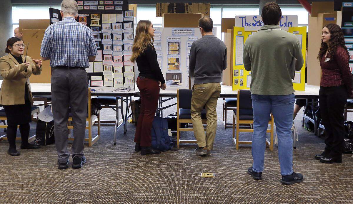 Students in the high school division answer quesstions about their projects for judges at the 71st annual Mid-Columbia Regional Science & Engineering Fair Thursday morning the WSU Tr-Cities campus in Richland. 
