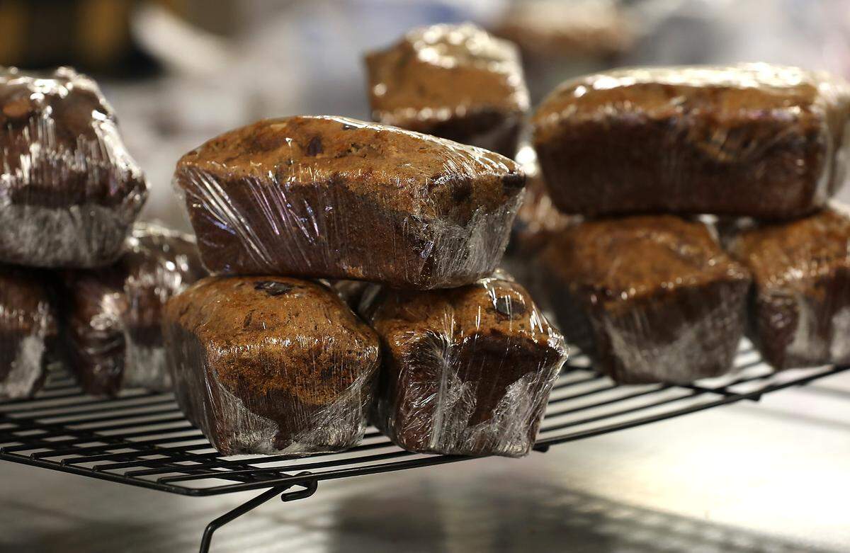 Fresh baked and wrapped loaves Aub’s Bananza Bread are stacked on a rack at the Pasco Specialty Kitchen in preparation for weekend sales.