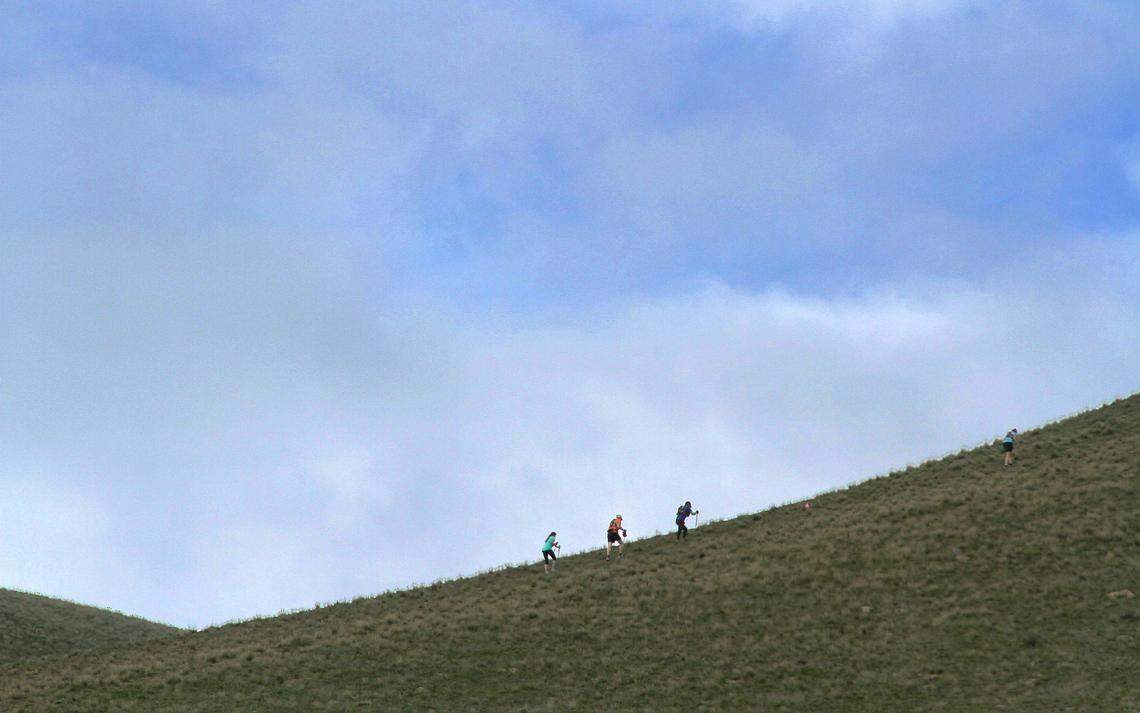 Hikers climb the hill off McBee Grade Road near Benton City during a Badger Mountain Challenge race.