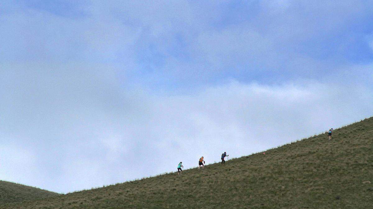 Participants hike up a hill off McBee Grade Road near Benton City during the Badger Mountain Challenge race in 2013.