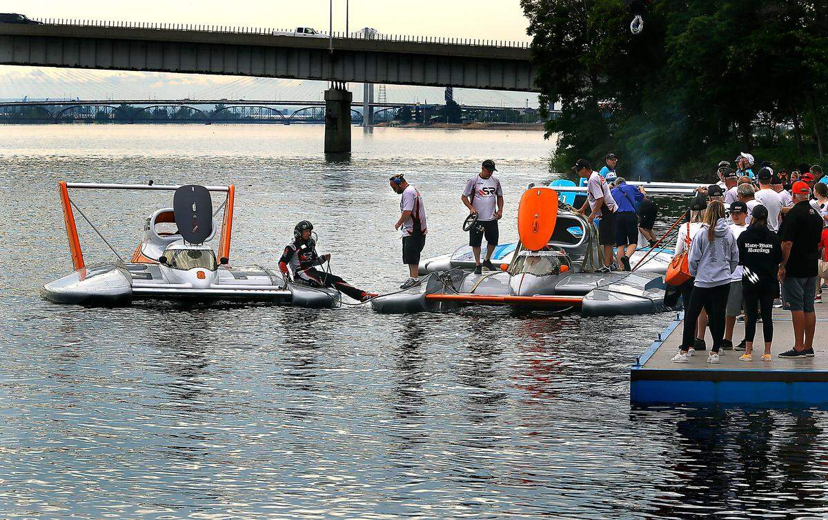 Unlimited hydroplane driver J. Michael Kelly sits on the deck of the U-8 Miss Tri-Cities preventing his race boat from rubbing against his team’s other boat, the U-9 Pinnacle Peak Consulting, following Friday first test run on the Columbia River during the spring testing day in Kennewick.