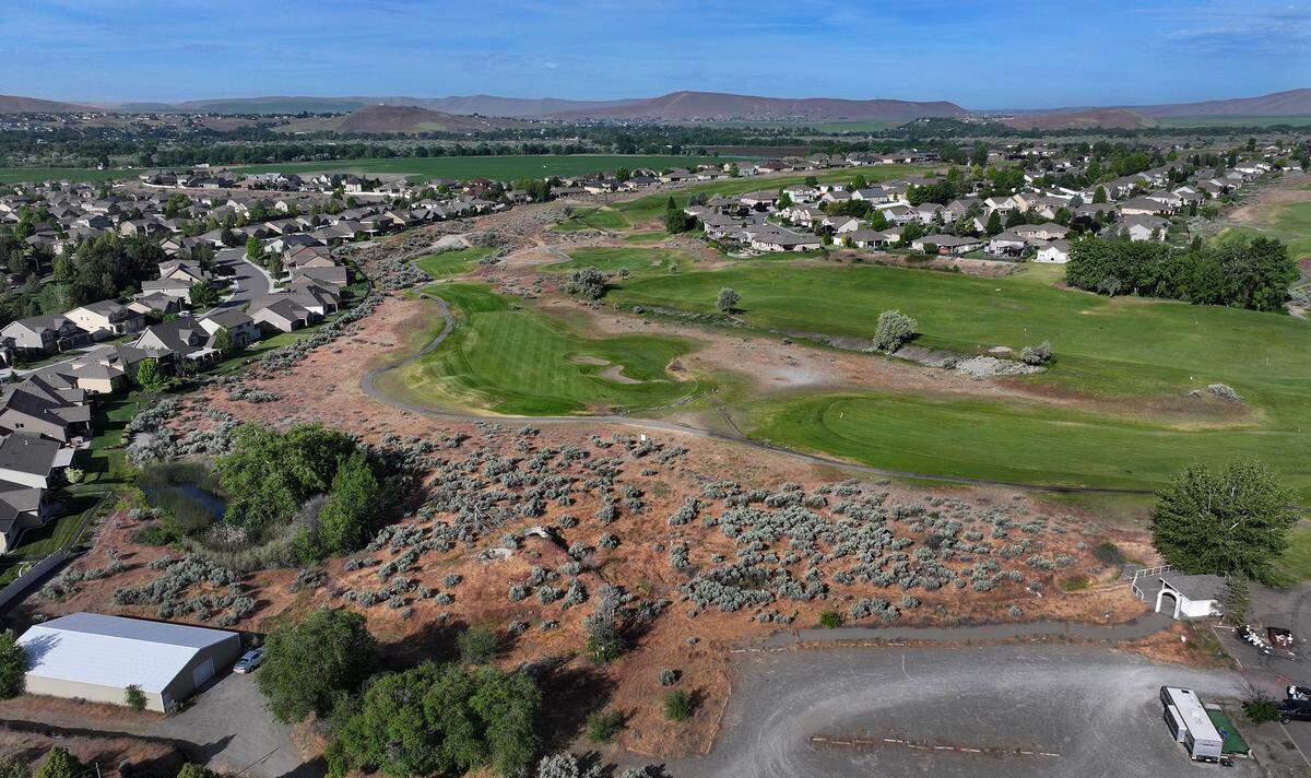 The Horn Rapids Golf Course and housing community is off Highway 240 and Kingsgate Way in Richland. This view shows open land near homes on Crosswater Loop, at left, next to the golf course.