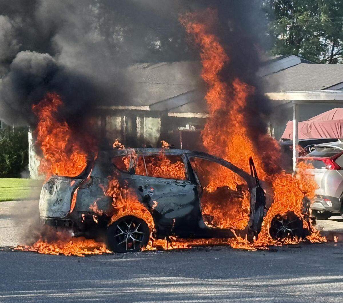 A vehicle burns near Road 44 and Pearly street in Pasco’s Riverview neighborhood Sunday morning.