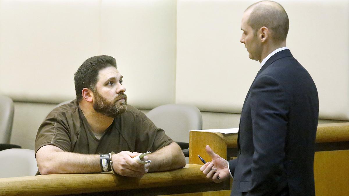 Jonathan P. Holden, 44, has been indicted by a federal grand jury on multiple child pornography charges. The evidence against the Spokane area man was discovered after his arrest in Richland for allegedly trying to meet up with a teen girl. He's pictured talking with attorney Caleb DiPeso during a February hearing in Benton County Superior Court in Kennewick.