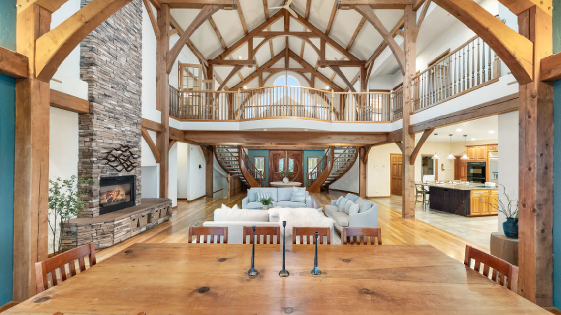 Sweeping staircase, vaulted cathedral ceiling. Not your usual Tri-Cities river view home