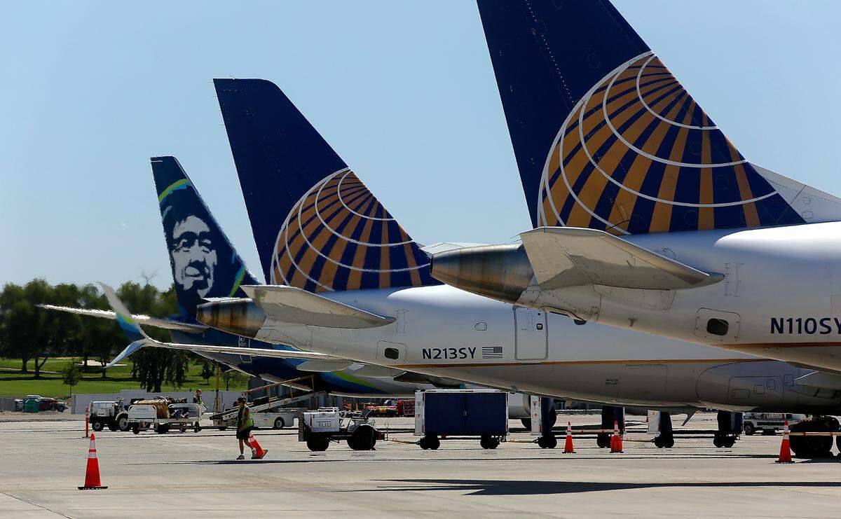 Passenger jet planes sit on the tarmac at the Tri-Cities Airport as they prepare to depart from Pasco.