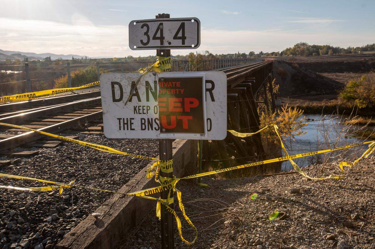 Railroad company officials are working to find money to replace a trestle and bridge destroyed by wildfire west of Tri-Cities.