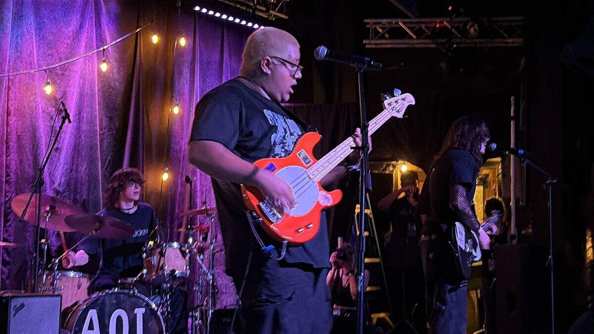 Walla Walla band Heel Klick on stage at the PUNKS WEAR BLXCK show at The Uptown Theatre on June 6. The trio plays PNW emo with alternative and indie influences.