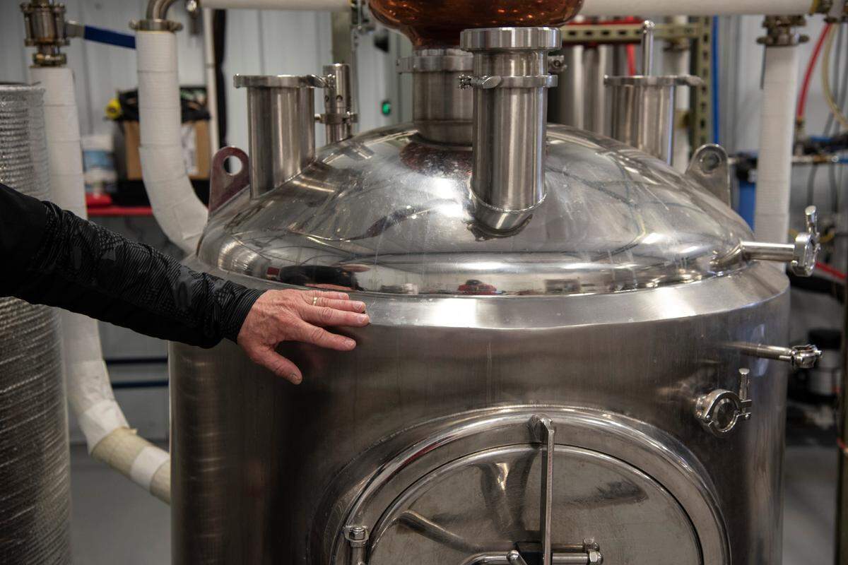 Jim Batdorf, CEO and head distiller at Solar Spirits, explains the distilling process for vodka on March 19. Solar Spirits has converted its distillery into a small batch hand sanitizer production facility to combat the demand for sanitizer.