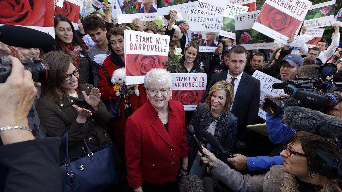 Barronelle Stutzman, center, a Richland florist who was fined for denying service to a gay couple in 2013, was surrounded by supporters after a 2016 hearing before Washington's Supreme Court. Stutzman was sued for refusing to provide services for a same sex-wedding and says she was exercising her First Amendment rights.