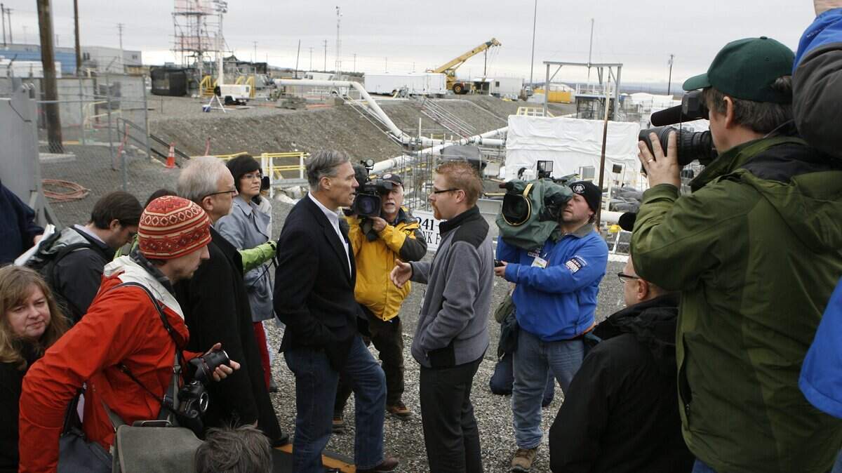 Washington Gov. Jay Inslee tours the Hanford tank farms in 2013 accompanied by Northwest news media. He opposes a federal plan to reclassify some of the radioactive waste stored there.