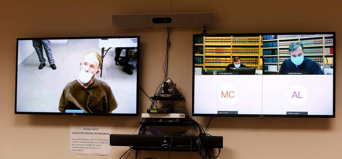 Suspect Michael Gene Cook, left, appears via video before Benton County Superior Court Judge Joe Burrowes for a preliminary hearing.