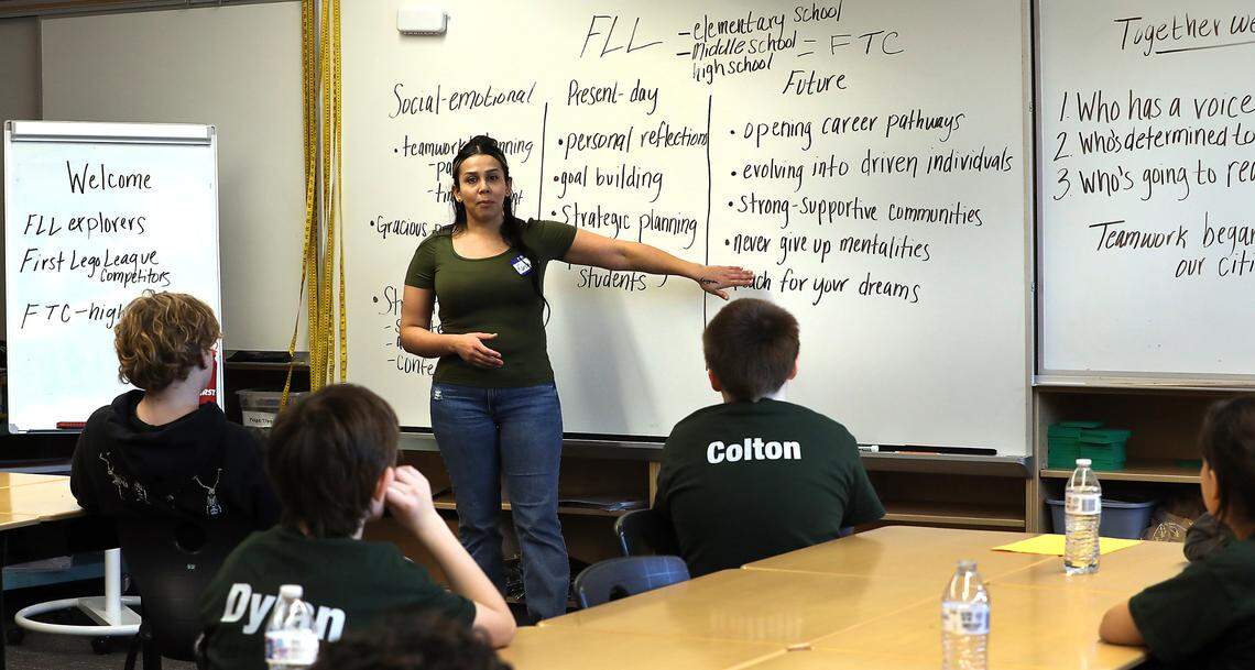 Parent coach Karla Orozco provides an overview of the First LEGO League goals and strategies during a meeting of the Dino Nuggys team at Marcus Whitman Elementary School in Richland.