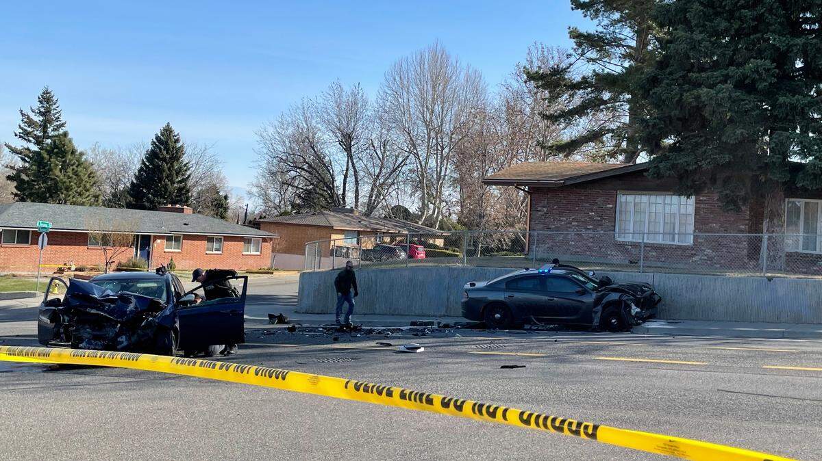 A woman is dead after an early morning crash in Kennewick that started with a shot fired at a police car, followed by a chase involving a Benton County sheriff’s deputy.