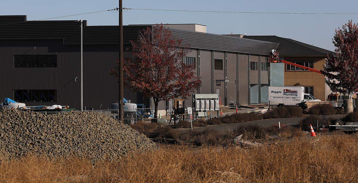 Construction workers continue their efforts on a new building being added to the campus of Calvary Chapel Tri-Cities at 10611 W. Clearwater Ave. in west Kennewick.