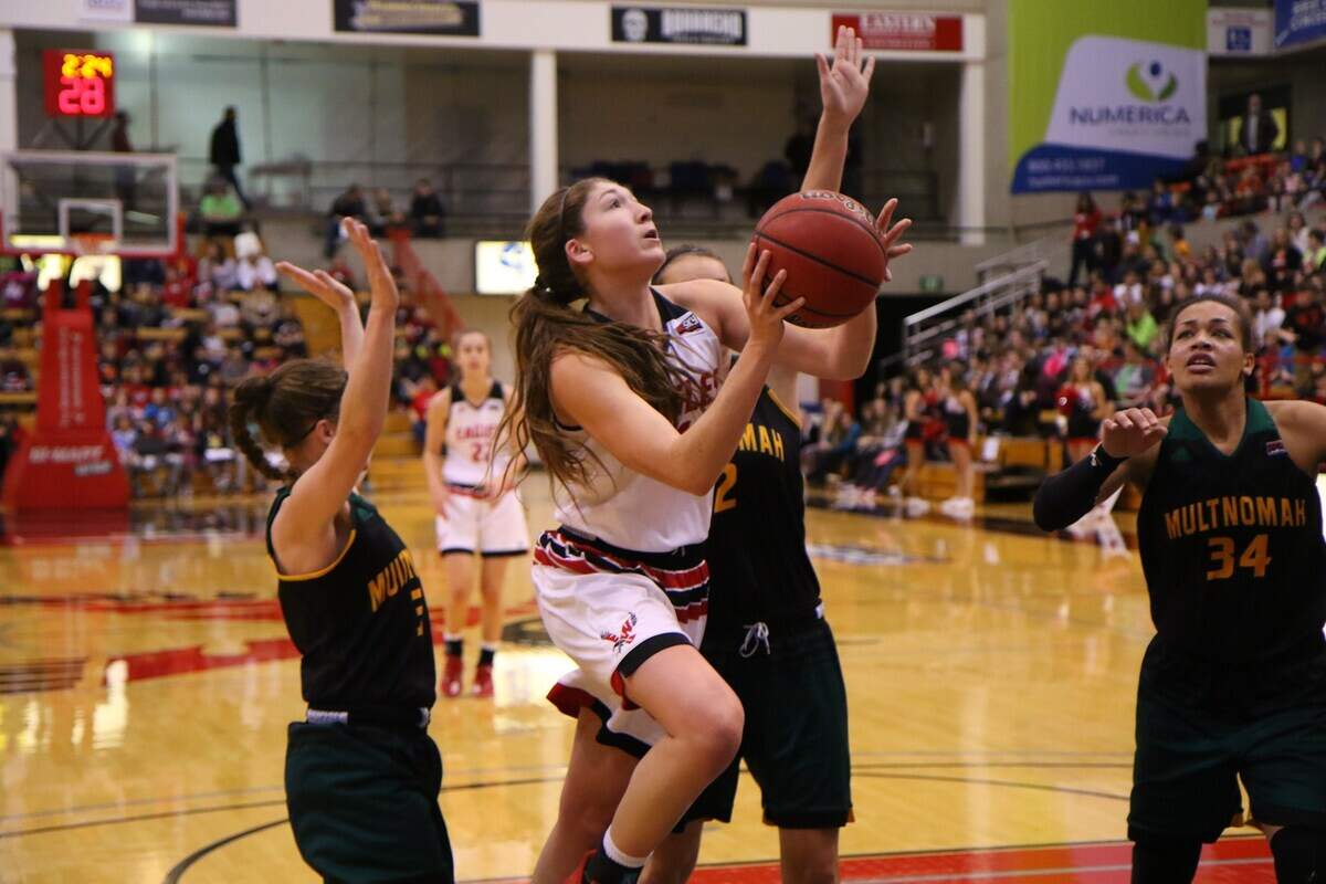 Former Eastern Washington standout Delaney Hodgins (in white) holds the school record for scoring with 2,120 points.