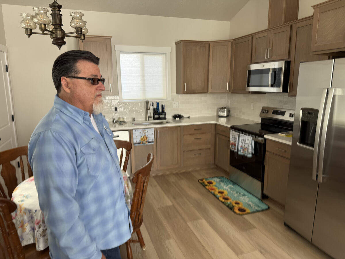 Kevin Gunn of Jacobs and Rhodes Heating and Air Conditioning gives a sneak peek of the house fans of Jimmy “Woo-Hoo” Butcher built to replace his water damaged home in Kennewick. The all-new home is complete and will be revealed at 2 p.m, Saturday, March 28.