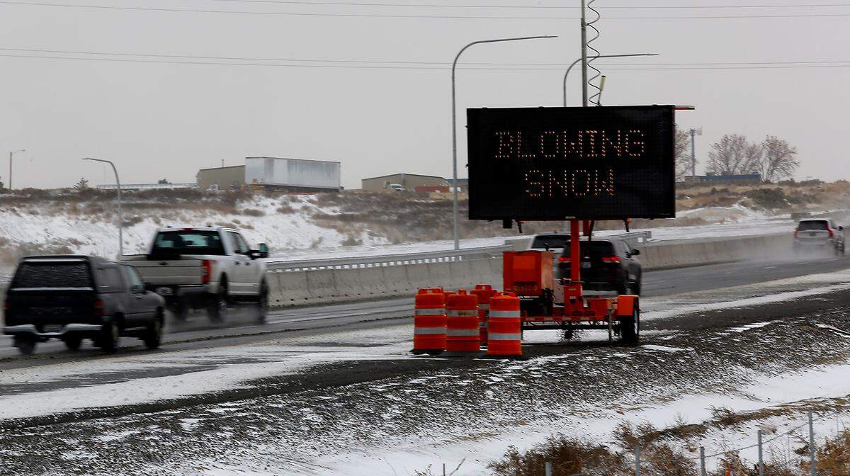 An electronic message board on Highway 395 in Kennewick warns travelers of blowing snow and winter driving conditions as they head south. An overnight snowstorm coated much of the Mid-Columbia creating hazardous driving conditions in many areas.