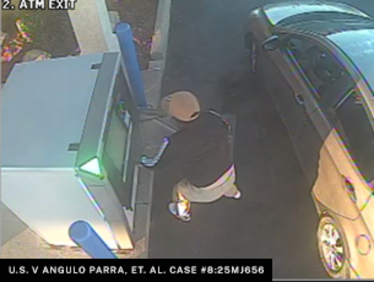 An alleged ATM jackpotting attack in progress.