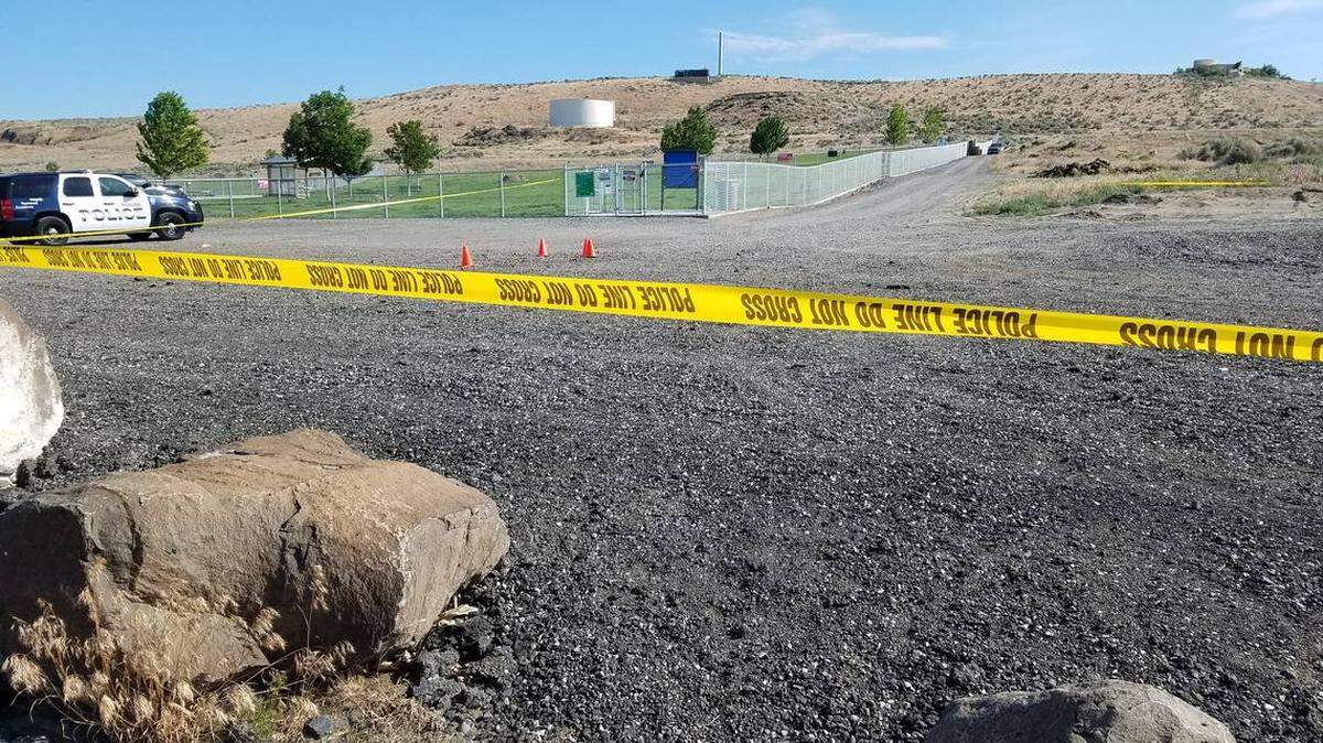 Police closed off an area of Badger Mountain Community Park after a shooting before dawn May 26.